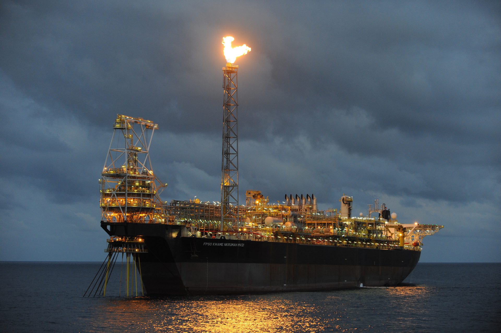 FPSO Kwame Nkrumah MV21 at dusk with gas flare